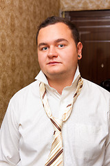 Image showing Portrait of a young man wearing shirt with unfastened necktie