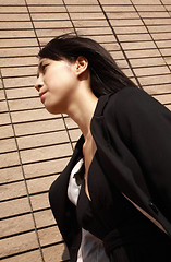 Image showing young asian business woman walking