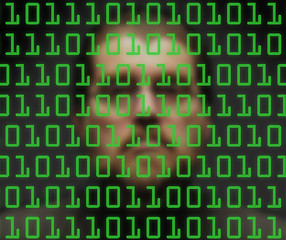 Image showing Man monitoring green binary code