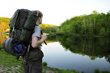 Image showing Teenage hiker standing by Sunrise Lake