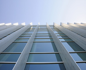 Image showing Exterior windows of modern commercial office building looking up