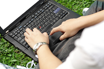 Image showing Man using a laptop outdoors