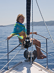 Image showing woman sitting on yacht nose