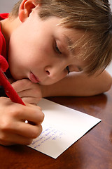 Image showing Boy writing note letter to santa