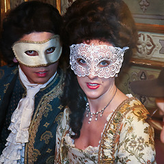 Image showing A masked couple in a cafe