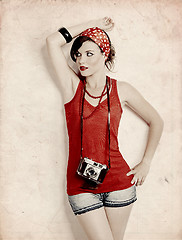 Image showing Pin-up girl with a camera