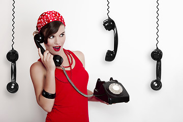 Image showing Girl with a vintage phone