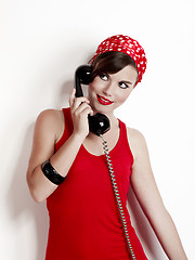 Image showing Girl with a vintage phone