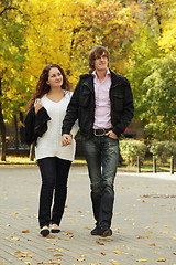 Image showing Couple walking by autumn park