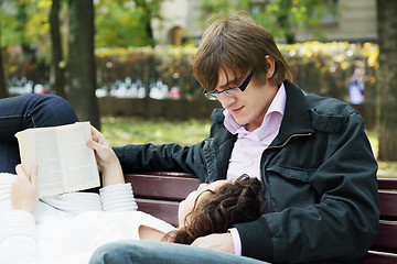 Image showing Relaxed couple with book