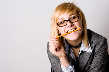 Image showing  young businesswoman with pencil 