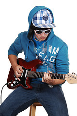 Image showing Teen boy with guitar.