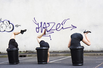 Image showing Dancers, head in a garbage