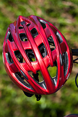 Image showing red helmet lying on the grass