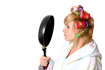 Image showing housewife with curlers and pan