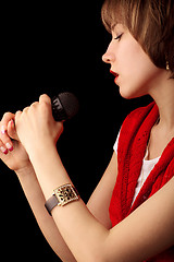 Image showing Young singer with microphone