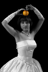 Image showing Bride posing with apple