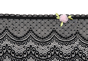 Image showing Black lace with rose satin flower on white background