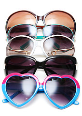 Image showing Much sunglasseses put in row