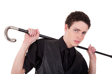 Image showing Young confident man holding a cane