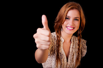 Image showing Young pretty women with thumb raised as a sign of success, thumbs up