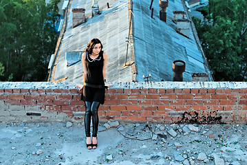 Image showing Girl on roof