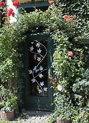 Image showing Overgrown garden gate