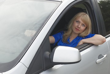 Image showing Young woman in car