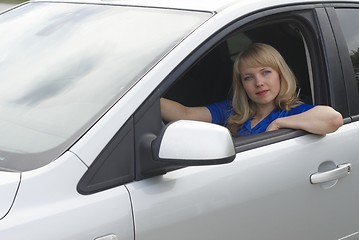 Image showing Young woman in car