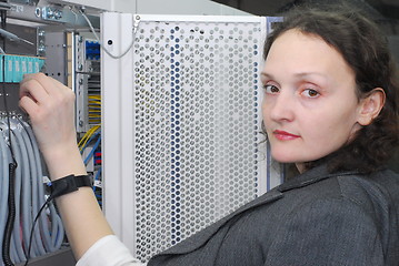 Image showing Woman working on telecommunication equipment