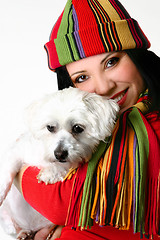 Image showing Beautiful woman holding a pet dog