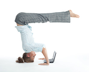 Image showing Woman browsing  in unusual pose