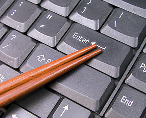 Image showing Chopsticks on keyboard