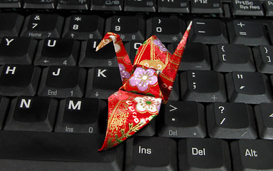 Image showing Origami on a laptop keyboard