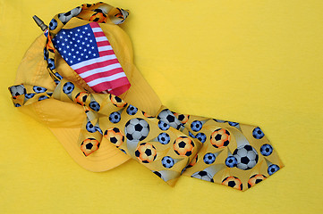 Image showing Yellow Baseball Cap, Necktie and US Flag