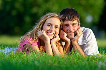Image showing Couple resting on the grass in the park