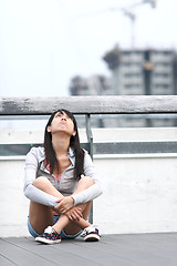 Image showing depressed girl looking to the sky