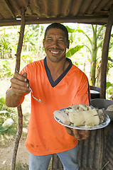 Image showing native Nicaragua man freshly cooked seafood rondon rundown food 