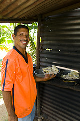 Image showing native Nicaragua man freshly cooked seafood rondon rundown food 