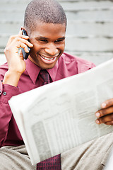 Image showing Businessman reading newspaper