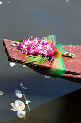 Image showing Orchids on an old wooden boat in Thailand