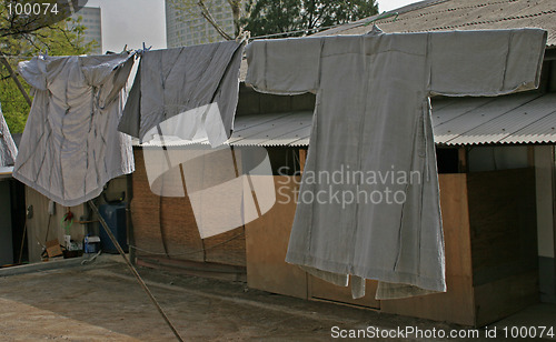 Image of Monks robes hanging on clothes line