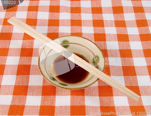 Image of Soy sauce and chopsticks