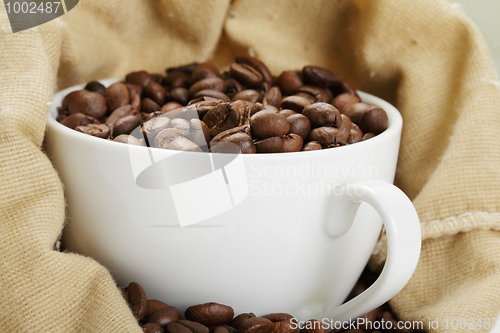 Image of White cup in coffee bag