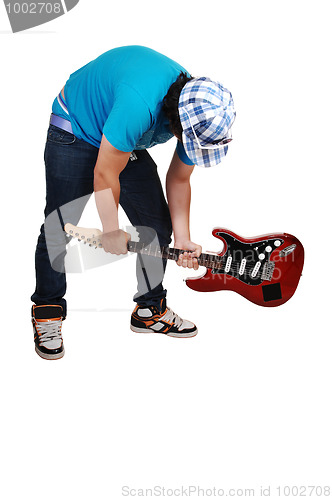 Image of Boy mad at the guitar.