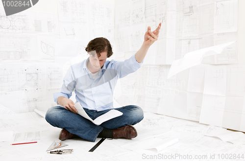 Image of Engineer checking drawings