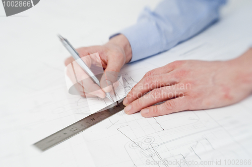 Image of Engineer making adjustments in a drawing