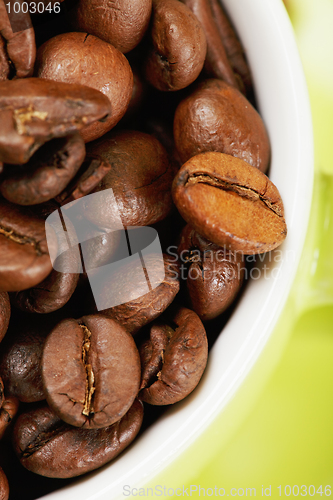 Image of Half of cup with coffee above view closeup