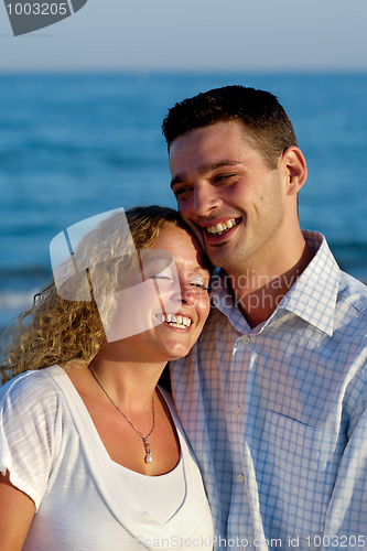 Image of Happy young couple at beach