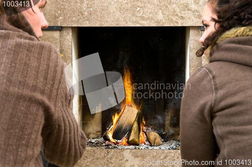 Image of By the fireplace